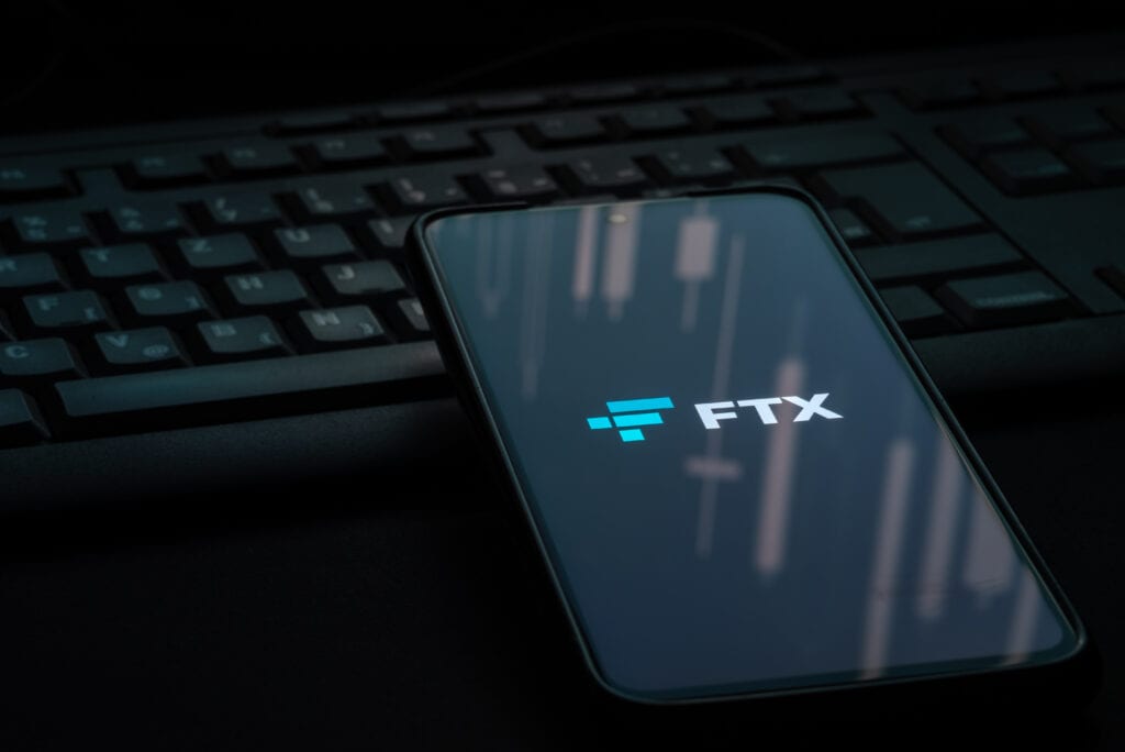 FTX cryptocurrency exchange logo on smartphone screen