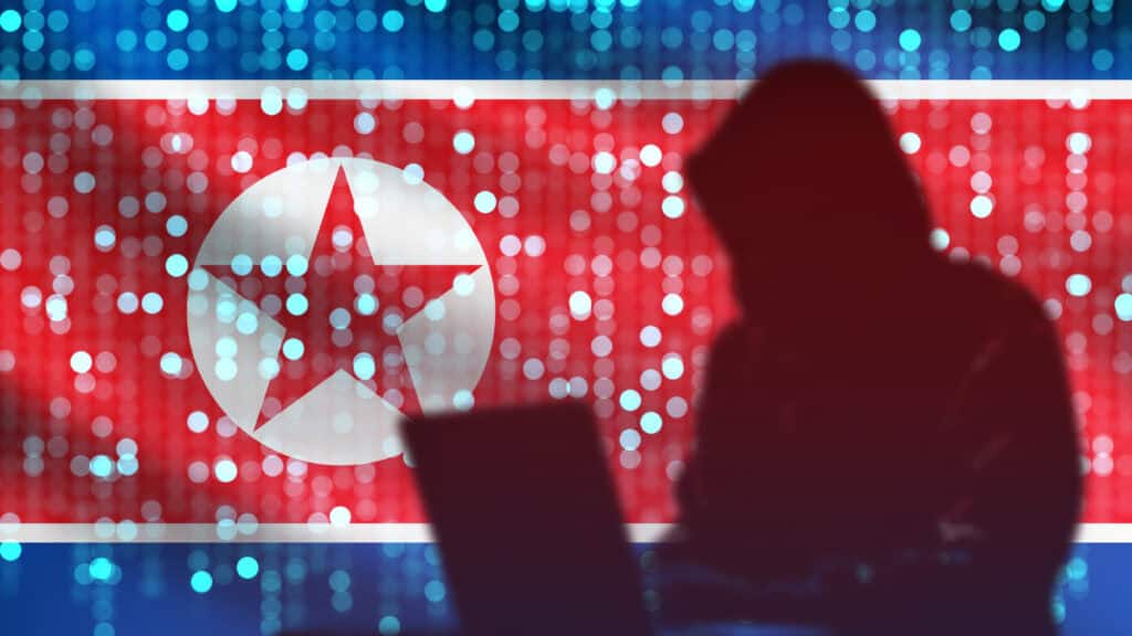 North Korea flag. Hacker silhouette