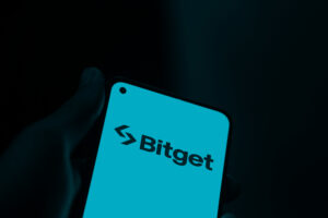 Bitget logo is displayed on smartphone.