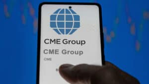 Close up on logo of CME Group on the screen of an exchange.