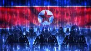 North Korea cyber army. Hackers with laptops. Silhouettes of people in hoods.