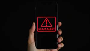 Scam alert on smartphone display