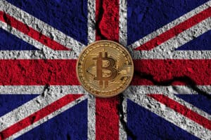 Bitcoin crypto currency coin with cracked UK flag.
