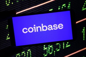 Coinbase company logo displayed on mobile phone