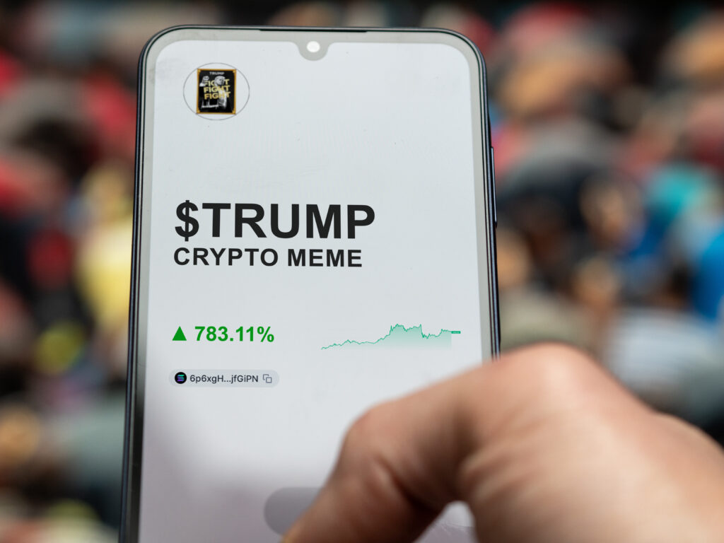 TRUMP meme, investor analyzing the $TRUMP performance on a crypto exchange application.