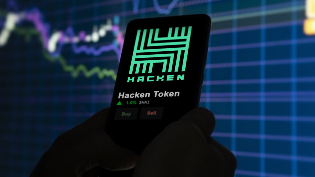 An investor analyzing the price of Hacken Token, the token coin $HAI on a crypto exchange sreen.