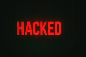HACKED red alert text on black background indicating cybersecurity breach