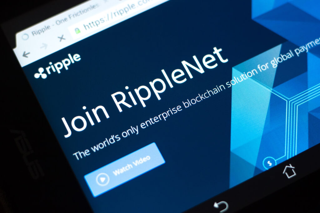 Homepage of Ripple cryptocurrency website - ripple.com on a display of PC.