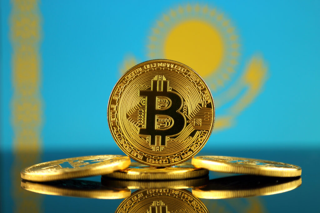 Physical version of Bitcoin (new virtual money) and Kazakhstan Flag.