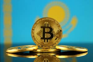 Physical version of Bitcoin (new virtual money) and Kazakhstan Flag.