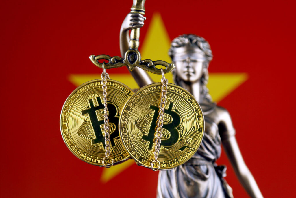 Symbol of law and justice, physical version of Bitcoin and Vietnam Flag.