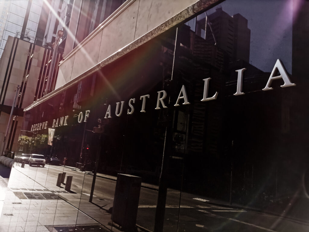 Reserve Bank of Australia name on black granite wall in Sydney Australia with lens flare