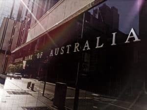 Reserve Bank of Australia name on black granite wall in Sydney Australia with lens flare