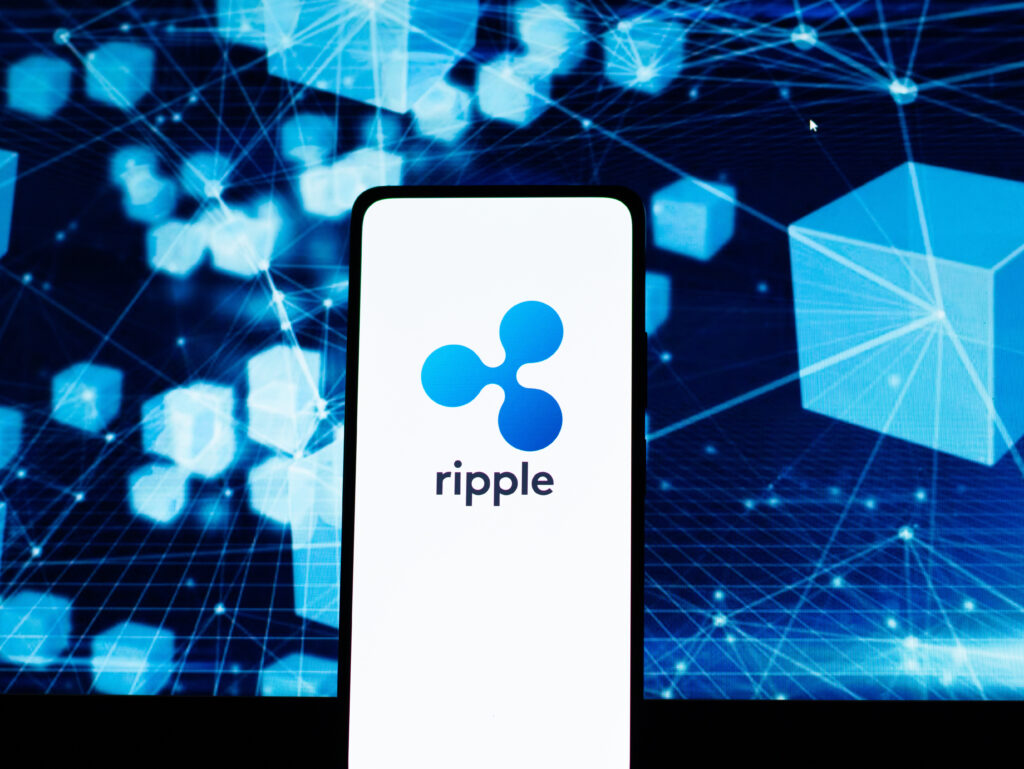 Ripple logo on phone screen stock image.