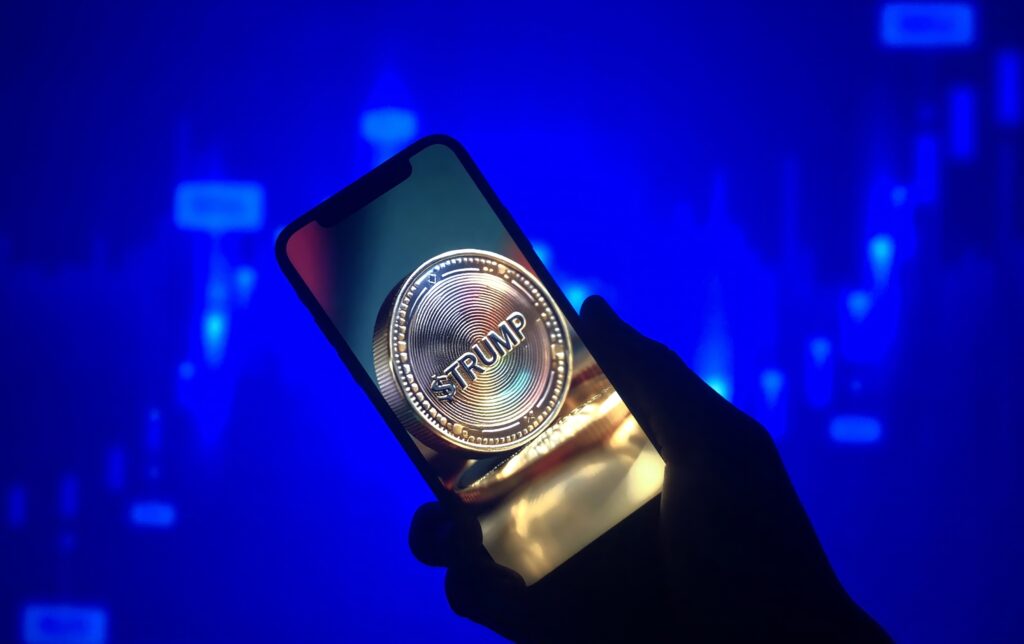 Smartphone with Trump meme coin, cryptocurrency concept, digital finance, political currency, investment risk