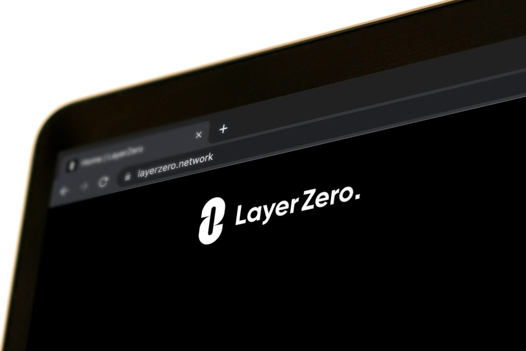 Official Layer Zero website is displayed on the screen of an Apple MacBook Pro.