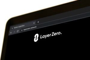 Official Layer Zero website is displayed on the screen of an Apple MacBook Pro.