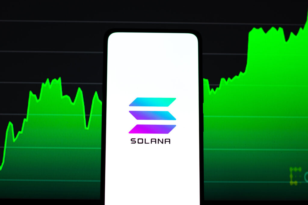 Solana logo on phone screen stock image.