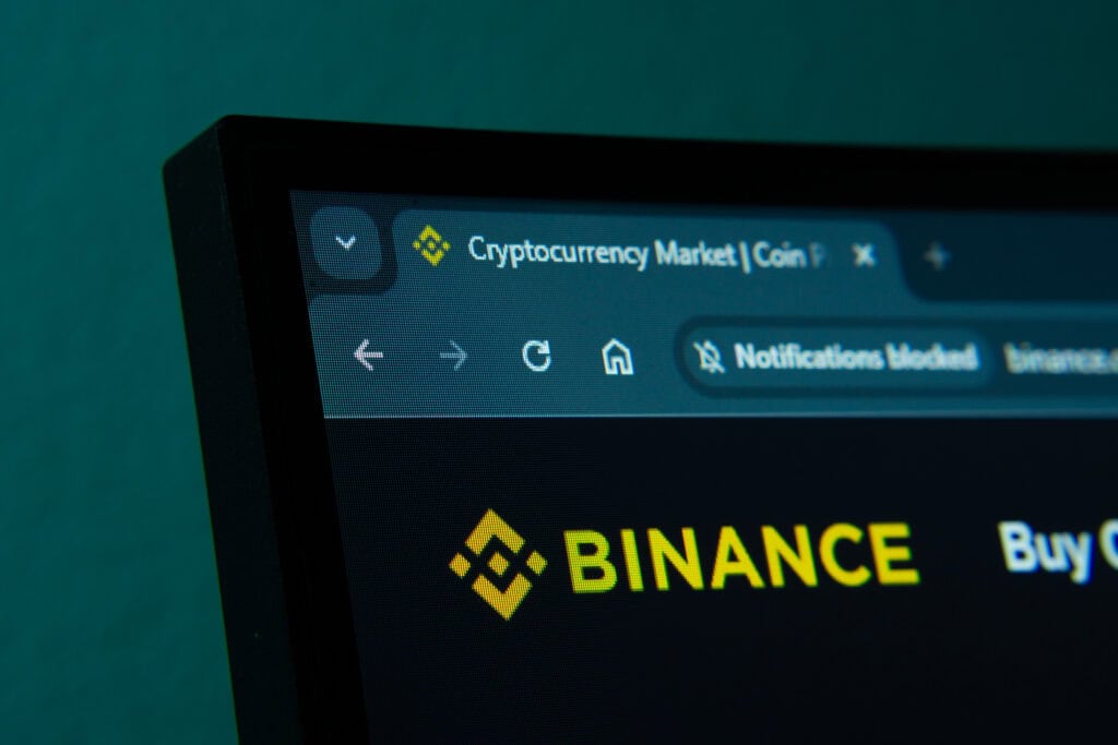 Close-up of a computer screen displaying the binance web interface in dark mode