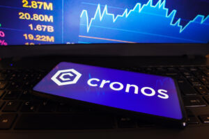 Cronos (CRO) logo is displayed on a smartphone screen.