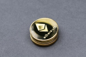 Ethereum coins on a gray background.