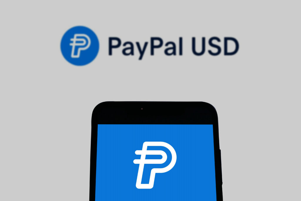 The logo of PYUSD on a smartphone.