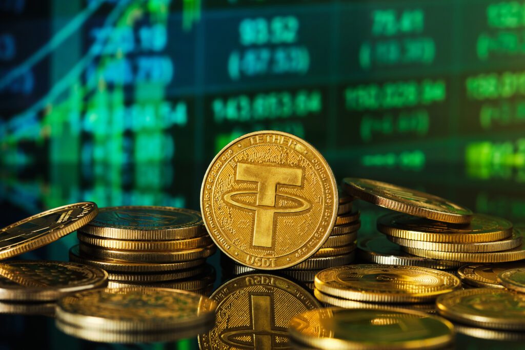 Tether Coins Stacked on a Reflective Surface With Digital Graphs in Background