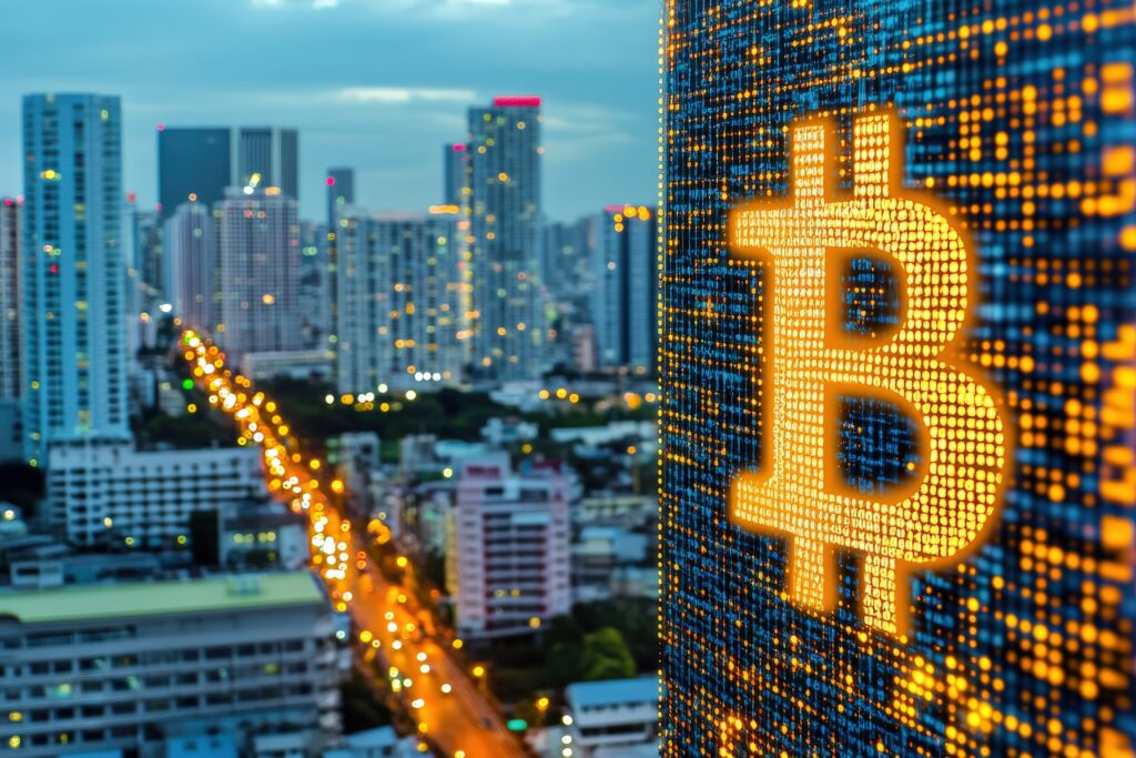 Vibrant Cityscape with Bitcoin Sign Illuminating Urban Landscape at Dusk